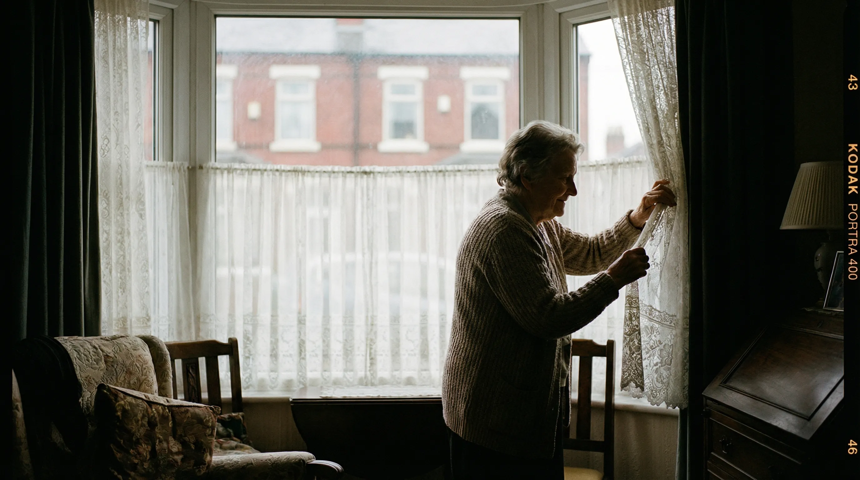 Elderly woman by curtains at home, representing privacy and dignity in smart home care